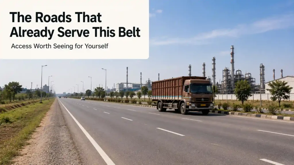 Wide industrial road with a truck representing existing road access near Barhana Industrial Area