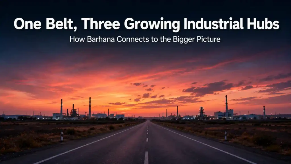 Road connecting multiple factory silhouettes representing the Rohtak-Jhajjar-Kharkhoda industrial corridor near Barhana